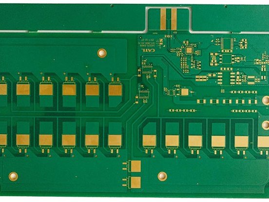 Green finished printed circuit board on a white background